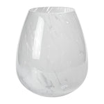 The Zodax Liguria Confetti Glass Vase features a round base and subtle white marbled patterns, making it an elegant décor piece for any space.