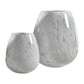 Two Liguria Confetti Glass Vases by Zodax—one large, one small—feature a white speckled, marbled design and are displayed side by side on a white background, ideal for adding elegant décor to any space.