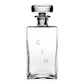 The Lillian Square Decanter Collection by William Yeoward Crystal features a handmade clear crystal decanter with "GIN" etched vertically and a stopper, making it an ideal gift. Displayed on a plain white background.