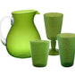The Memento Lime Acrylic Drinkware Collection features a green pitcher with clear handle, two tumblers, and a goblet—translucent pieces ideal for bringing bold color to outdoor dining.