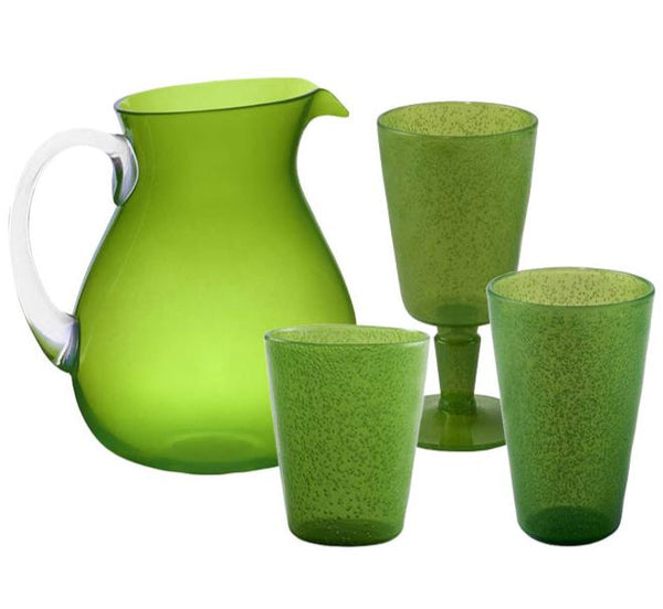 The Memento Acrylic Drinkware Collection in Lime features a green pitcher with a clear handle, two textured green tumblers, and one goblet on a white background. These bold, stylish pieces add vibrant functionality to any outdoor dining setting.