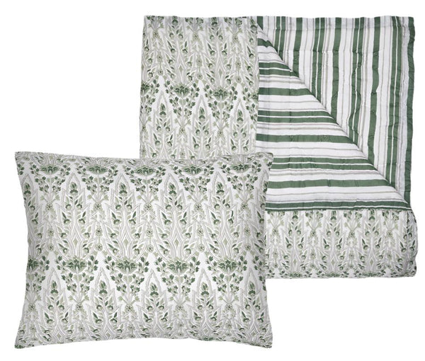 The John Robshaw Lina Sage Bedding Collection offers a green and white patterned pillow and quilt set, hand quilted in soft cotton voile. The reversible quilt displays floral and striped designs that evoke the vibrant textiles of Ladakh.