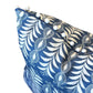The Little Zanzibar Down Pillow by Hive Custom Pillows is a charming handmade accent for your space, featuring a blue cover with a white fern-like pattern and small white pom-pom trim along the edge. This 22x22 pillow adds decorative flair to any room.