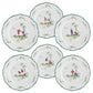Set of six white plates from the Raynaud Longjiang Dinnerware Collection, each adorned with green-trimmed edges, a central scene of two figures with a tree, and green floral accents inspired by Vieux Marseille faience.