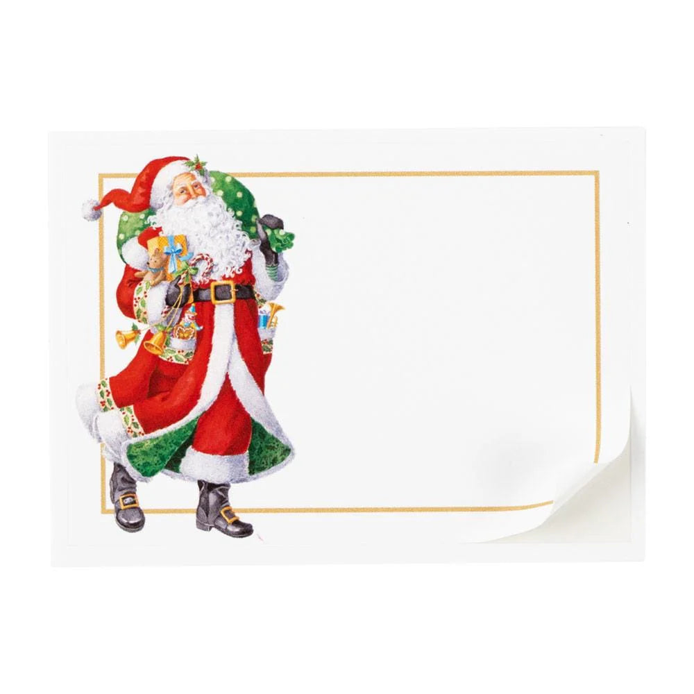 An illustration of Santa holding gifts adorns the left of a blank, bordered label with a curled corner from Caspari's Woodland Santa Collection—ideal for labeling elegant paper plates or festive tableware this holiday season.
