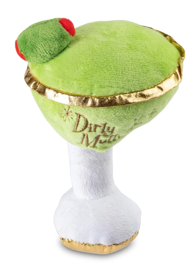 The Haute Diggity Dog Muttini Plush Toy is a green martini glass-shaped dog toy with a red olive, gold trim, and "Dirty Muttini" on the side. It includes a hidden squeaker for added fun!.