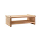 The Matthew Coffee Table by Made Goods is a rectangular wooden table with an open shelf, rounded edges, a natural wood finish, and stylish full-grain leather trim.