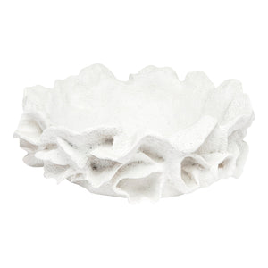 The Made Goods Coco Bowl White features a textured, coral-inspired design with an uneven, ruffled edge that resembles a flower, making it a striking decorative accent.