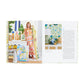 An open book displays "Designing Rooms With Joie de Vivre" by Abrams: Amanda Reynal holds patterned fabric rolls on the left, while the right shows a decorated interior and text about her fresh take on classic style.