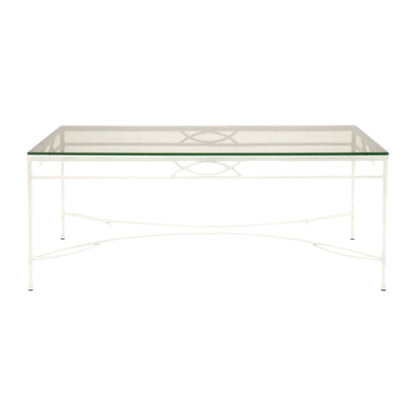 The Amalfi Cocktail Table in White Vermouth by Janus et Cie features a rectangular glass top, white metal frame, and decorative crossbar—perfect for stylish outdoor spaces.