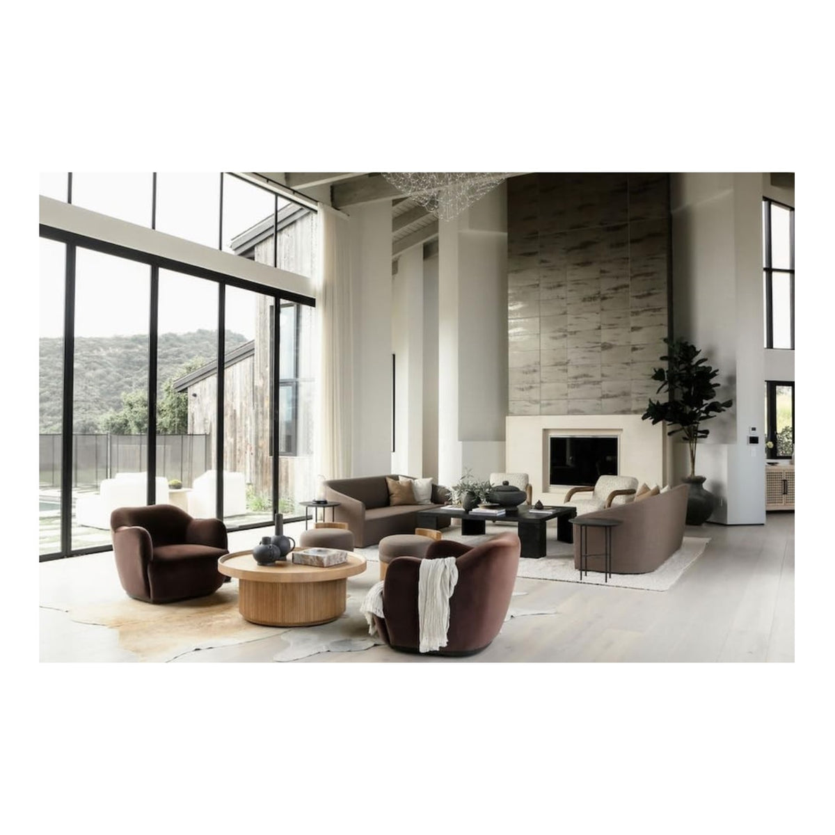 Modern living room with floor-to-ceiling windows and curated decor—explore inspiration in Meridith Baer: The Making of a Home by Abrams.