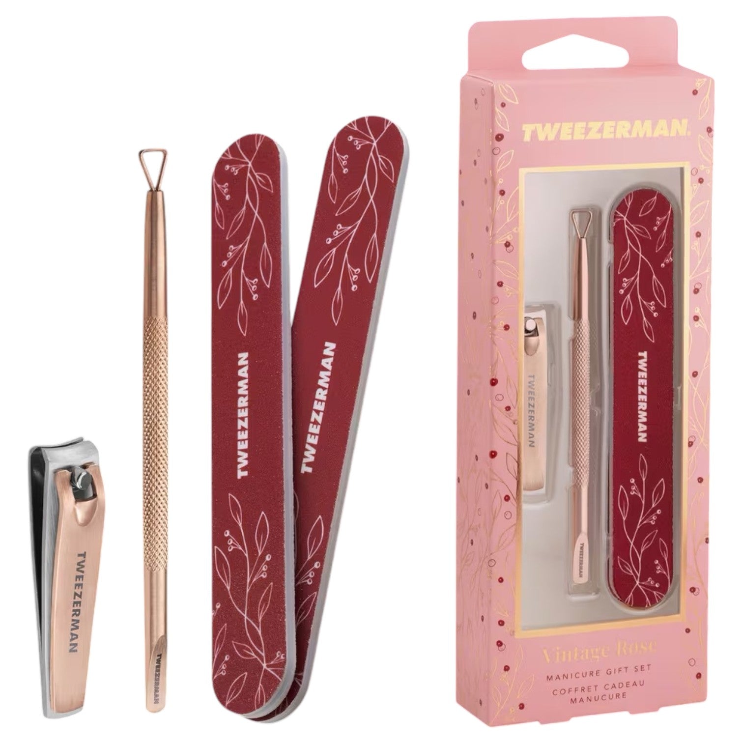 The Tweezerman Vintage Rose Gift Set includes nail clippers, a cuticle pusher, and two floral nail files, all elegantly arranged beside its pink Tweezerman packaging.