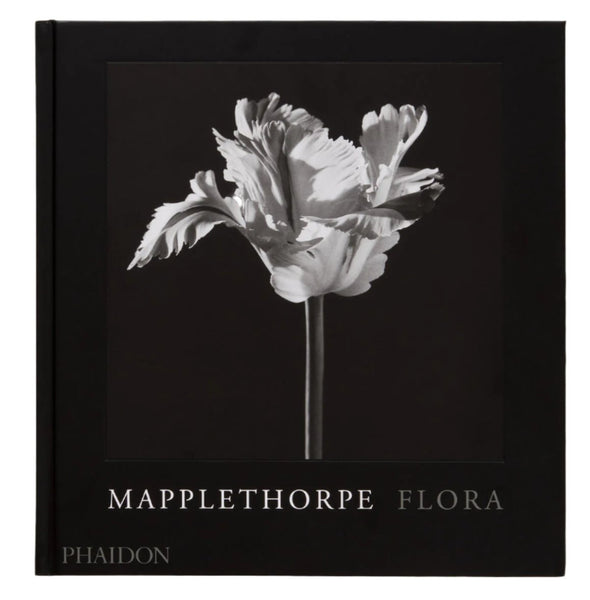 The cover of "Mapplethorpe Flora: The Complete Flowers" by Phaidon features a black and white flower image against a dark backdrop, highlighting Robert Mapplethorpe's iconic twentieth-century artistic style.