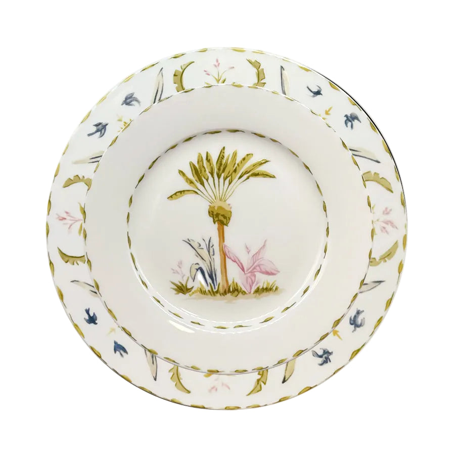 A fine bone china plate from Duggan Society's Marina Palms Dinnerware Collection, featuring a palm tree with pink and blue foliage and a green-gold border, adds coastal elegance to any table.