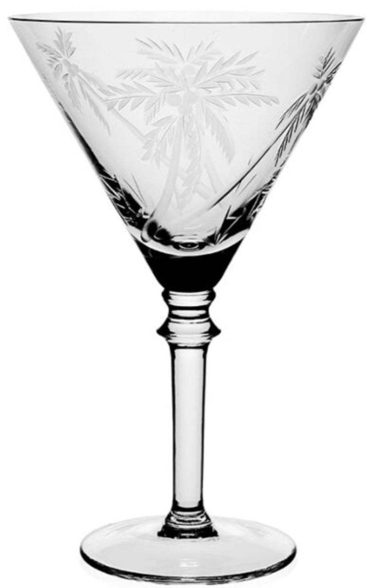The William Yeoward Crystal Palmyra Collection martini glass features an etched palm tree design, evoking the tranquil vibe of Palmyra Atoll, and is shown against a white background.