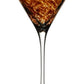 A Vanessa Tortoise Collection martini glass by William Yeoward Crystal features a brown and gold marbled bowl that creates an optical illusion, set against a white background.