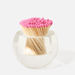 The Acrylic Match Striker Collection by Tart by Taylor adds charm to your coffee table, with pink-tipped matches artfully displayed in a clear vessel for a stylish accent.