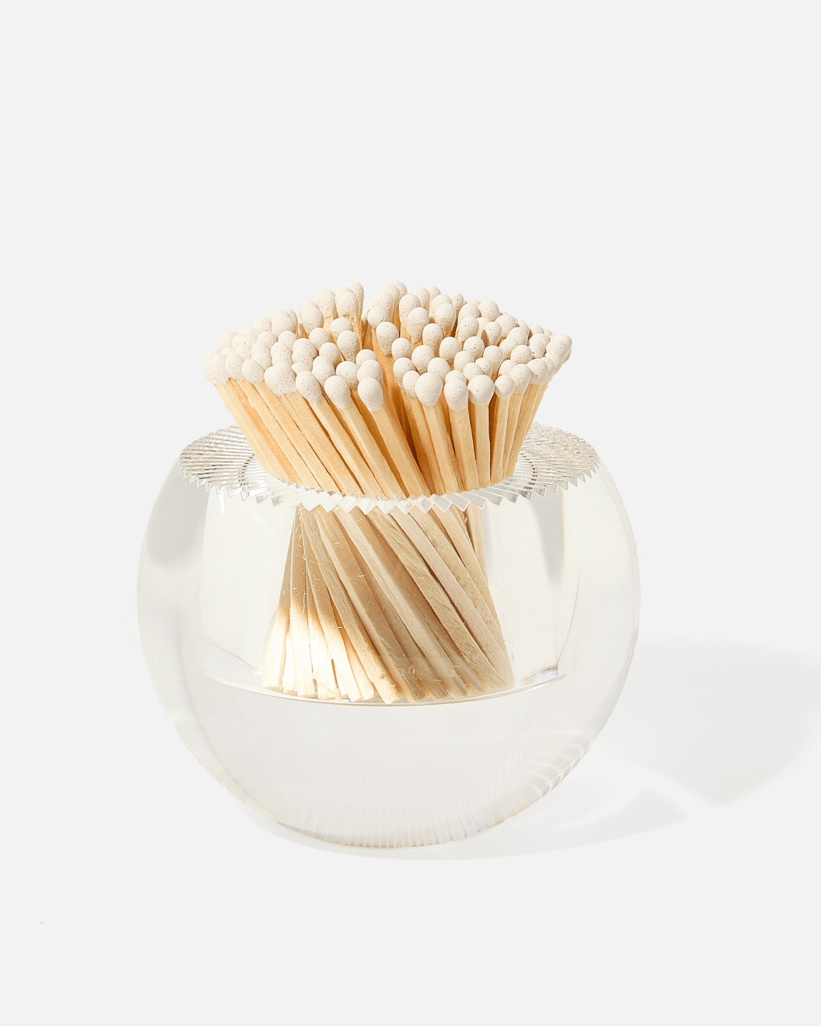 A clear glass container holds white-tipped wooden matches, arranged upright—an elegant accessory from Tart by Taylor’s Acrylic Match Striker Collection, perfect for pairing with your favorite acrylic match striker or decorative strike pad.