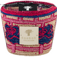 Colorful woven basket with a Baobab Collection label, featuring a mix of pink, blue, and neutral tones, ideal for holding Baobab Collection Frida Draozy candles.