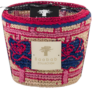 Colorful woven basket with a Baobab Collection label, featuring a mix of pink, blue, and neutral tones, ideal for holding Baobab Collection Frida Draozy candles.