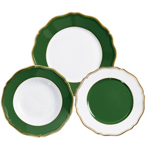 Three decorative plates from the Raynaud Mazurka Or Fond Vert Collection, featuring gold-trimmed scalloped edges and hand-painted green and white sections arranged in different patterns.