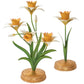 The Juliska Meadow Walk Daffodil Candle Holder Collection features three decorative candlestick sculptures with yellow and white flowers, green stems, and gold bases—perfect for adding charm to your candelabra display.