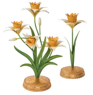 The Juliska Meadow Walk Daffodil Candle Holder Collection features three decorative candlestick sculptures with yellow and white flowers, green stems, and gold bases—perfect for adding charm to your candelabra display.