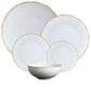 The Corail Gold Collection by Medard de Noblat/Devine features five white ceramic dishes with textured patterns and gold rims—four plates of varying sizes and a bowl—for an elegant, whimsical addition to your dinnerware.