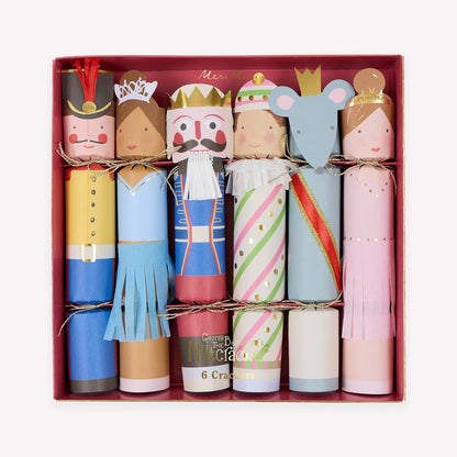 A box of six Meri Meri Nutcracker Ballet Crackers decorated as Nutcracker ballet characters, including a soldier, a prince, and a mouse for festive table favors.