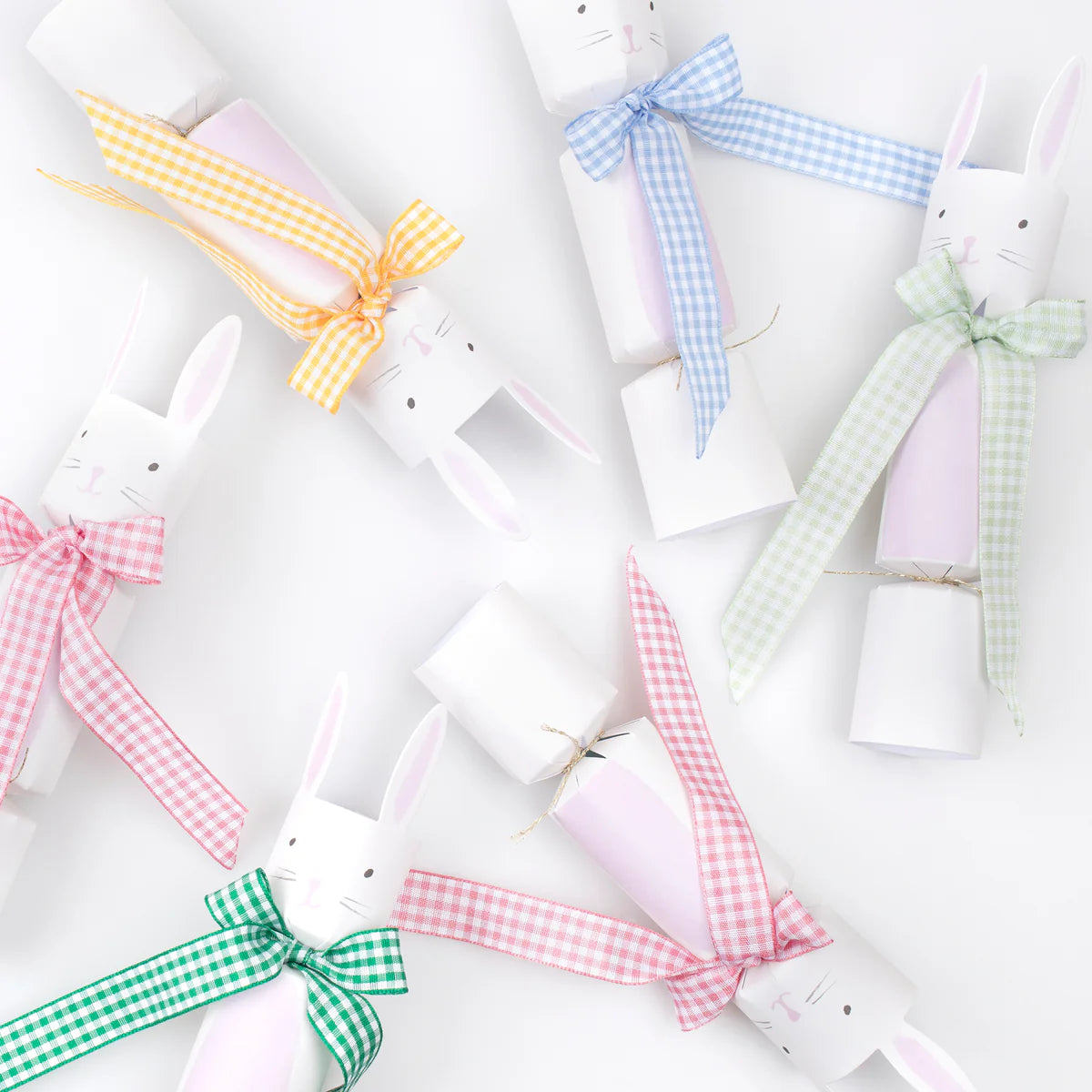 Add a charming touch to your table with Meri Meri’s Gingham Bow Bunny Crackers—five luxury crackers, each shaped like a bunny and decorated with pastel gingham bows in yellow, blue, green, and pink. Perfect for festive springtime decor!.