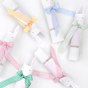 Add a charming touch to your table with Meri Meri’s Gingham Bow Bunny Crackers—five luxury crackers, each shaped like a bunny and decorated with pastel gingham bows in yellow, blue, green, and pink. Perfect for festive springtime decor!.