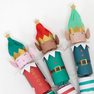 Meri Meri's Elf Large Crackers feature festive elves with colorful hats, gold stars, pointed ears, and bright outfits—perfect for adding holiday fun to your Christmas table.