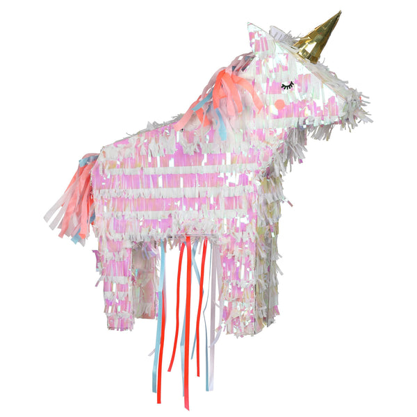 A colorful unicorn Meri Meri Party Piñata decorated with pastel pink, white, and gray fringes and featuring a gold horn, isolated on a white background.