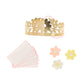 Decorate your party table with Meri Meri’s Pink Tissue Floral Crackers, gold floral paper crown, four pastel flower cutouts, and four pink-bordered cards for a charming bridal shower display.