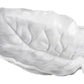 White ceramic dish shaped like a leaf, featuring raised veins and curved edges, captures the elegance of Beatriz Ball's Vida Lettuce Serveware Collection in luxury melamine—viewed from above on a plain background.