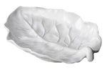 White ceramic dish shaped like a leaf, featuring raised veins and curved edges, captures the elegance of Beatriz Ball's Vida Lettuce Serveware Collection in luxury melamine—viewed from above on a plain background.