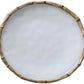 This round white plate from the Beatriz Ball Vida Natural Bamboo Dinnerware Collection features a bamboo-style rim, blending luxury style with break-resistant melamine.
