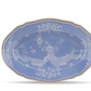 A blue oval porcelain platter from the Oriente Italiano Pervinca Serveware & Decor Collection by Ginori 1735, featuring a gold rim and delicate white floral patterns inspired by classic Oriente Italiano designs, displayed against a white background.