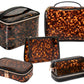 The Miami Tortoise Travel Collection by Stephanie Johnson features five tortoiseshell-patterned cosmetic bags with faux-leather trim in assorted shapes and sizes—perfect for stylishly organizing your essentials.