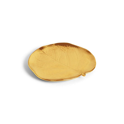 The Michael Aram Botanical Leaf Gold Tidbit Plate Set features small, gold leaf-shaped plates perfect for serving or pairing with your favorite botanical coasters, adding a touch of artisanal luxury to any setting.