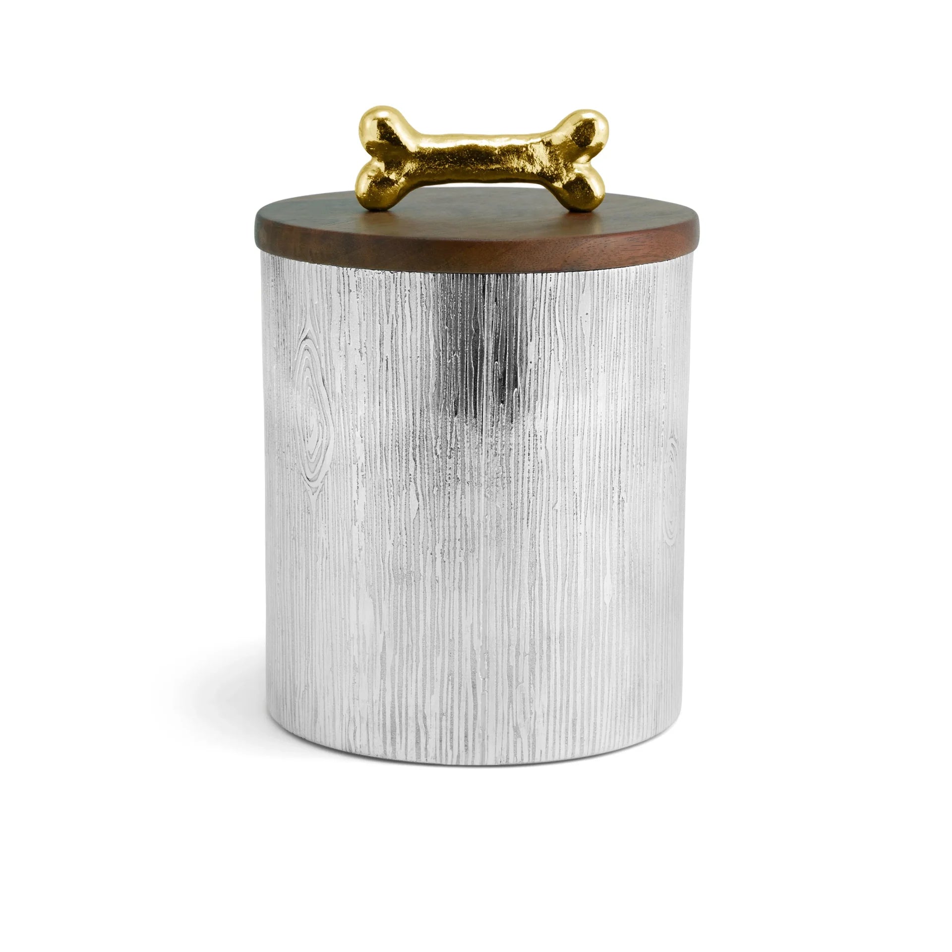 Introducing the Dog Bone Canister by Michael Aram—a round, silver container from the Flights of Fancy Collection, featuring a wood-patterned texture, a wooden lid, and a gold bone-shaped handle that brings whimsical charm to any space.