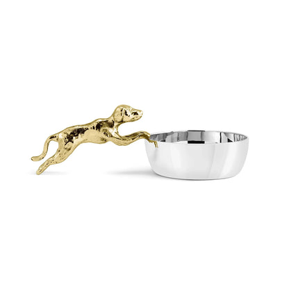 Introducing the Dog Scoop by Michael Aram—a polished silver bowl featuring a gold-colored, hand-sculpted clay running dog attached to the rim. Perfect for adding whimsical decor to your home, this piece is part of the Flights of Fancy Collection.