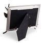 The Michael Aram Dogwood Frame features a goldtone finish, black velvet back and stand, and is supported by metal branches, shown here from the rear.