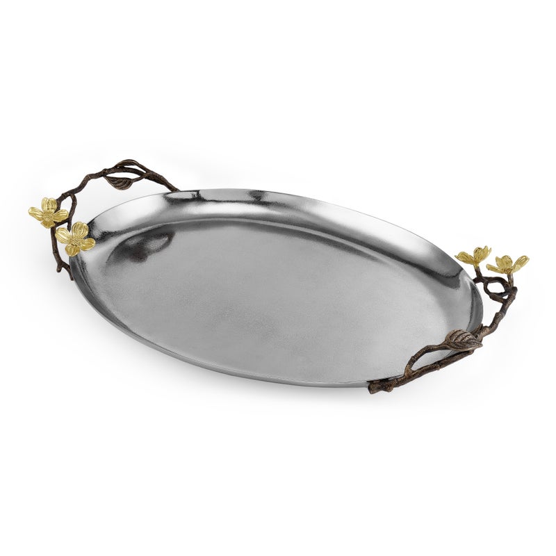 Handcrafted oval silver tray from the Michael Aram Dogwood Serveware Collection, featuring ornate dark handles detailed with gold-toned flowers and branch motifs for a striking, nature-inspired look.