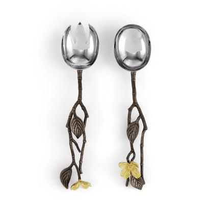 From the Michael Aram Dogwood Serveware Collection, these two serving utensils feature branch-shaped metal handles with leaf and flower accents—one solid, one slotted—for a nature-inspired touch.