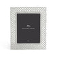 The Michael Aram Love Knot Silver Frame Collection features an 8x10 inch silver metal photo frame with a lattice design and includes a placeholder card.