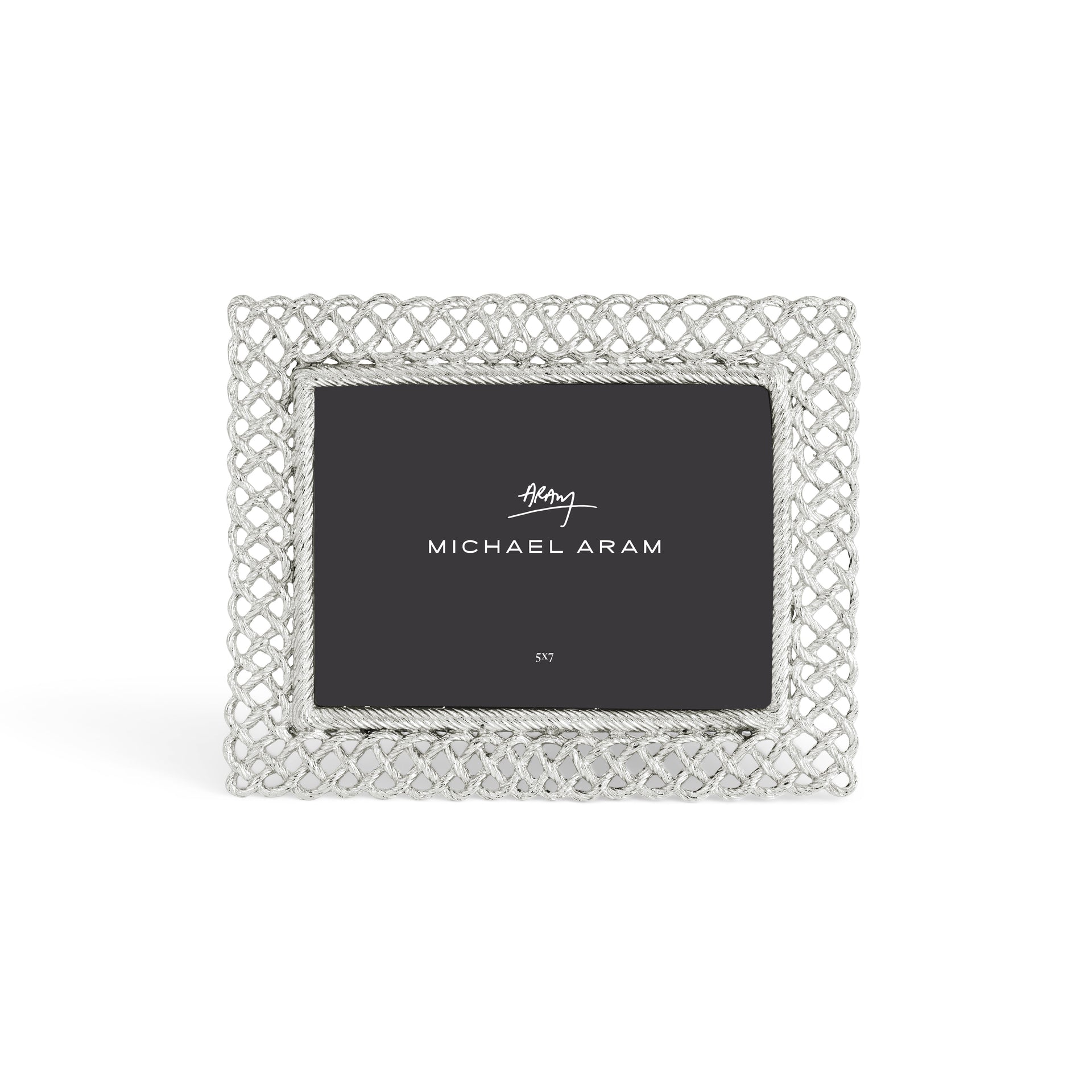 The Michael Aram Love Knot Silver Frame Collection features a decorative silver frame with an intricate lattice design, symbolizing unity, and includes a 5x7 placeholder card.
