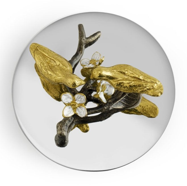 The Michael Aram Lovebirds Trinket Box features two gold-toned birds on a dark branch with white flowers, capturing Tree of Life charm in a decorative accessory.