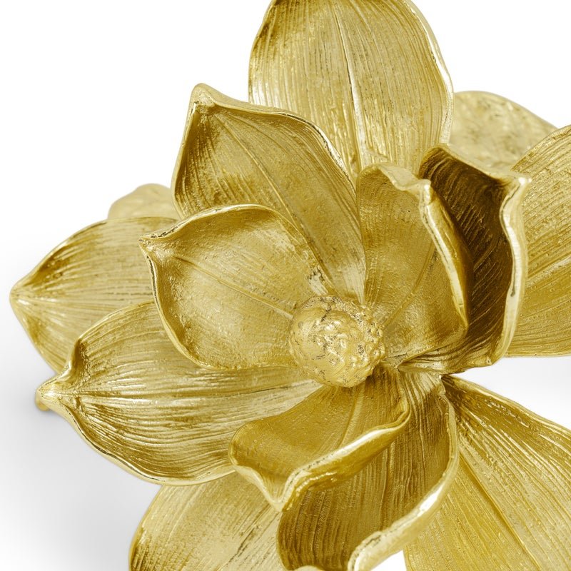 Close-up of the Magnolia Decorative Object by Michael Aram, a handcrafted brass sculpture featuring intricately textured petals.