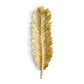 A gold-toned feather-shaped decorative piece from the Michael Aram New Leaves Serveware Collection is displayed against a white background, reflecting the collection’s elegant, nature-inspired design.